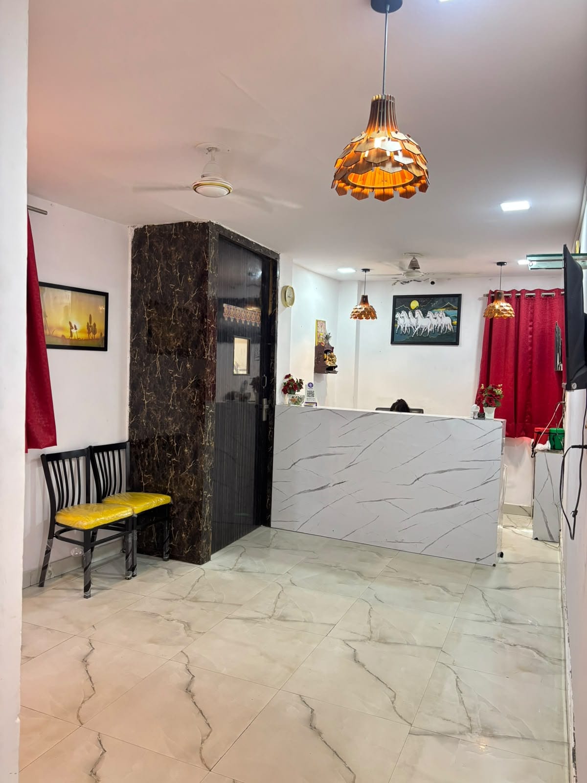 Hotel Samrat Residency Premium Deluxe Room bed and modern lighting details